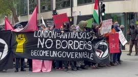 Antifa counter-protesters wait for anti-migrant march on UK Home Office amid major police presence