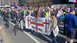 'Refugees NOT welcome' sign at far-right march outside UK parliament