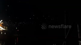 Hundreds of seagulls swarming a fishing trawler at night in the Hope's of getting a free meal.