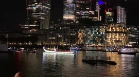 150 vessels covered in lights pass through the Thames in Central London in honour of The Queen