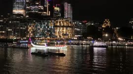 150 vessels covered in lights pass down the Thames in London in honour of the Queen