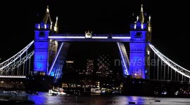 The Reflections flotilla reaches an illuminated Tower Bridge, paying tribute to Her Majesty the Queen