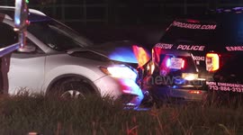 Driver rear-ends police cruiser blocking traffic for investigation of earlier fatal accident on I-45 in Houston, Texas