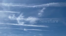 Interesting human-like shape formed by clouds in blue sky over sea