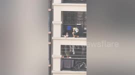 Chinese man rescues toddler dangling from 7th-floor balcony