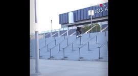 Skateboard snaps in half as man crashes while jumping down 18 stairs