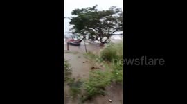 Waves hit boat during Typhoon Noru in Philippines