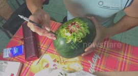 Artist sculpts amazingly detailed butterfly pattern into watermelon