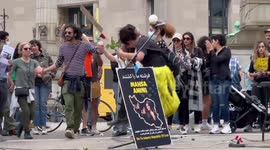Music and dancing in a circle at the protest for Mahsa Amini in New York, US