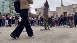 Iranian man cuts hair off during Mahsa Amini protest in New York