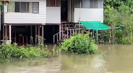 Homes flooded after heavy rain in northeast Thailand as Typhoon Noru approaches