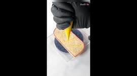 Baker turns tasty 'Happy Birthday' cookie into a GROOVY, COLORFUL delight