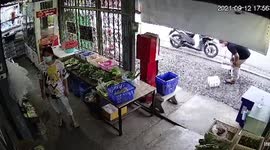 Hilarious moment customer's loose shorts drop while he carries water bottles