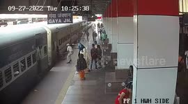 A Indian Woman dangerously dragged by moving train gets rescued in Northern India