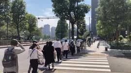 Long line of people heading to offer flowers at Shinzo Abe funeral in Tokyo, Japan