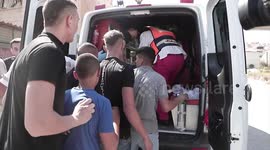 Palestinians carry woundeds after an Israeli army assault on Jenin refugee camp