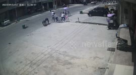 Passersby move cover back onto manhole after truck flipped it over in China