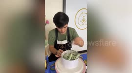 Thai artist sells practical birthday 'cakes' made out of banknotes