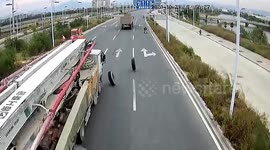 Tyre knocks over scooter rider after falling off truck in China