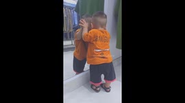 Hilarious moment 14-month-old boy sees himself in the mirror for the first time