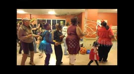 Toddler dances with family