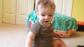 Baby doesn't like frog toy
