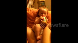 Baby bites peanut butter jar