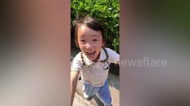 'Papa!' Chinese girl overjoyed as her father makes surprise visit home