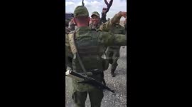 Russian soldiers perform traditional dance before they're sent to frontlines