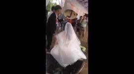 A lovely wading: Couple marry in ankle-deep water during Typhoon Noru