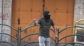 Palestinian protesters clash with Israeli forces following a protest against settlement
