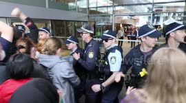 Protesters against CPAC Australia 2022 held back by line of police in Sydney