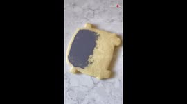 Cookie artist uses royal icing to make a groovy 1972 VW van cookie