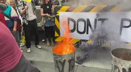 Protesters burn energy bills during Enough is Enough rally