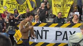 Protesters burn energy bills during Enough is Enough rally