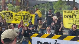 Protesters burn energy bills during Enough is Enough rally