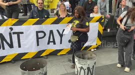 Protesters burn energy bills during Enough is Enough rally