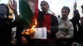 Iranian protesters burn national flag as hundreds march to Parliament Square in solidarity with Mahsa Amini