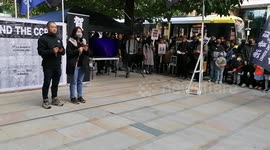 Hong Kong solidarity protesters stood listening to the national anthem of UK.