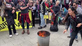 Brighton protesters burn their household bills at Don't Pay Protest