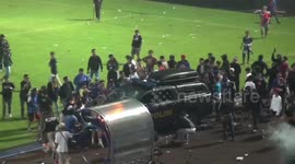 See the moment police and fans brutally clash at Indonesia football tragedy