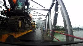 Traffic jams when an excavator gets stuck on a bridge in Indonesia