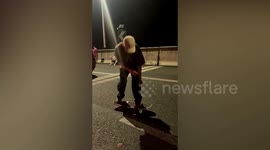 Motorists play badminton and skateboard as highway gridlocked ahead of China's national holiday
