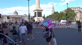 Princess castle balloon is knocked about by TCS London Marathon crowds at Trafalgar Square