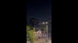 Man in Spider-Man costume seen dangling from wires across road in Russia