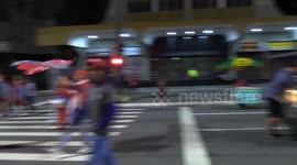 Brazilians celebrate candidate Lula's success by gathering on streets and waving flags