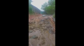 Roads to village destroyed as flash floods hit Vietnam and kill eight