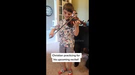 Boy born without eyes practises the violin despite abuse from online trolls