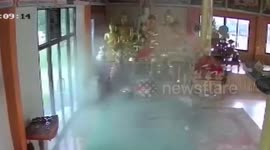 Thai temple ceiling collapses after bird nest weighed down by rainwater crashes through panels