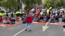 Just Stop Oil climate activists block streets in Parliament Square.